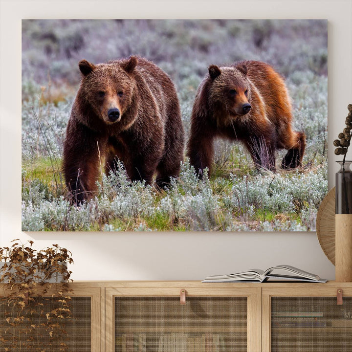 The "Grizzly 399 in Wild Flowers" wall art canvas print, showcasing grizzly bears amidst vibrant wildflowers, elegantly captures the enchanting essence of nature. This handmade piece from the USA brings striking beauty to any space.