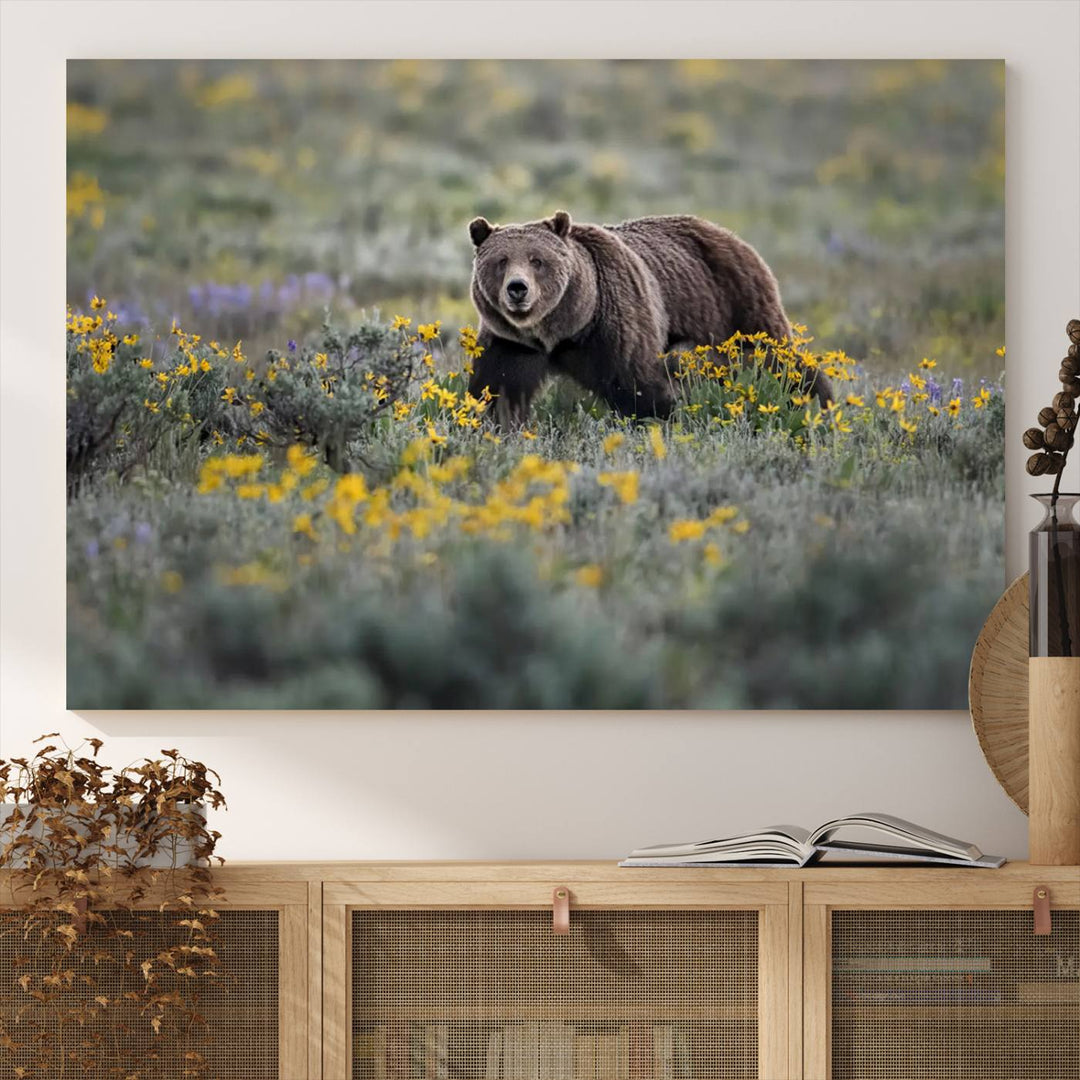 The "Queen of the Tetons" is a stunning canvas wall art print featuring Grizzly 399 walking through a field of yellow and purple flowers, showcasing the gallery-quality finish.