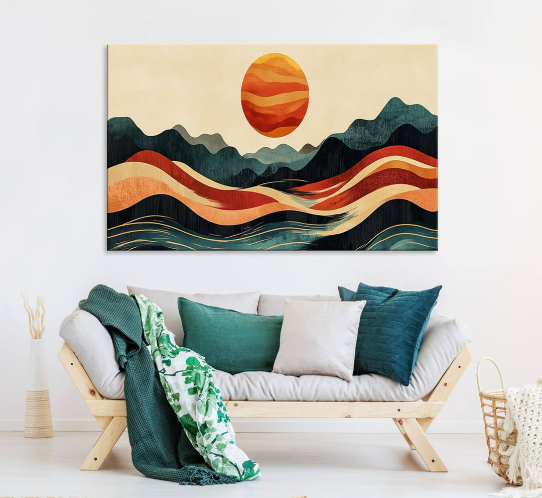 The Mountain Triptych wall art, featuring a design of the sun, mountains, and waves, is displayed prominently on the wall.