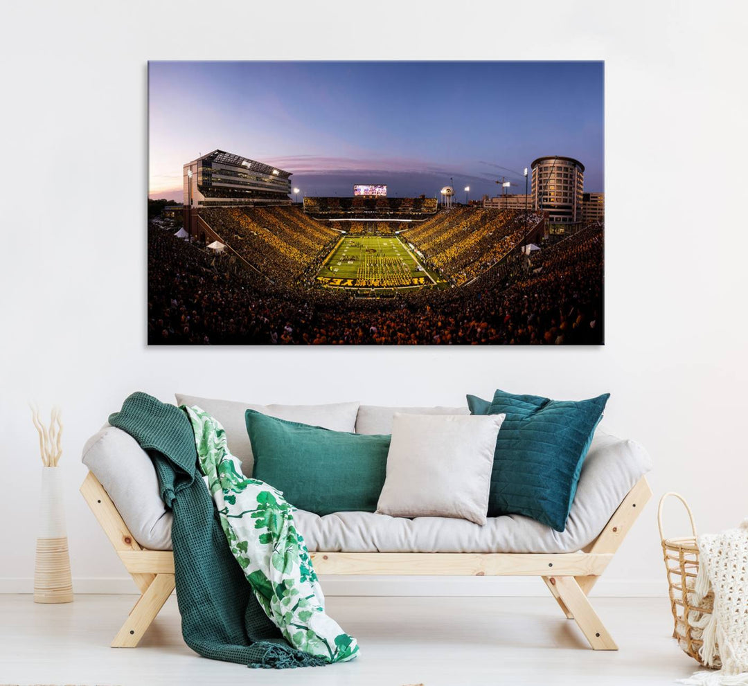 The Iowa Hawkeyes Kinnick Stadium Wall Art Canvas Print captures a sunset scene, making it perfect for display on a wall.