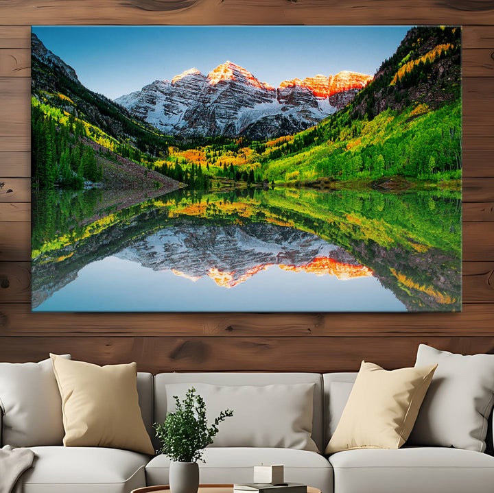 The Sunrise Maroon Bells Lake Wall Art Print beautifully captures North Maroon Peak mirrored in the tranquil lake, framed by lush greenery.