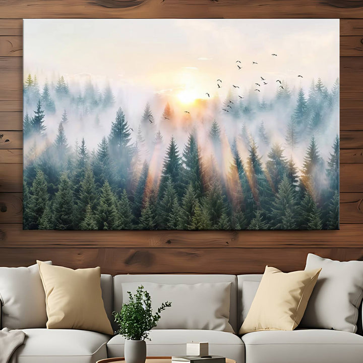 Misty Pine Forest Wall Art: A depiction of sunrise over foggy trees and birds against a bright sky; a framed woodland scene ideal for home or office decor.