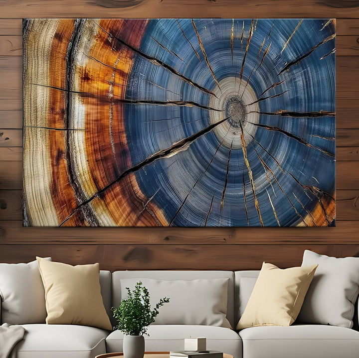 Close-up of blue, brown, and orange wood grain rings on the Abstract Tree Rings Canvas Wall Art Print.