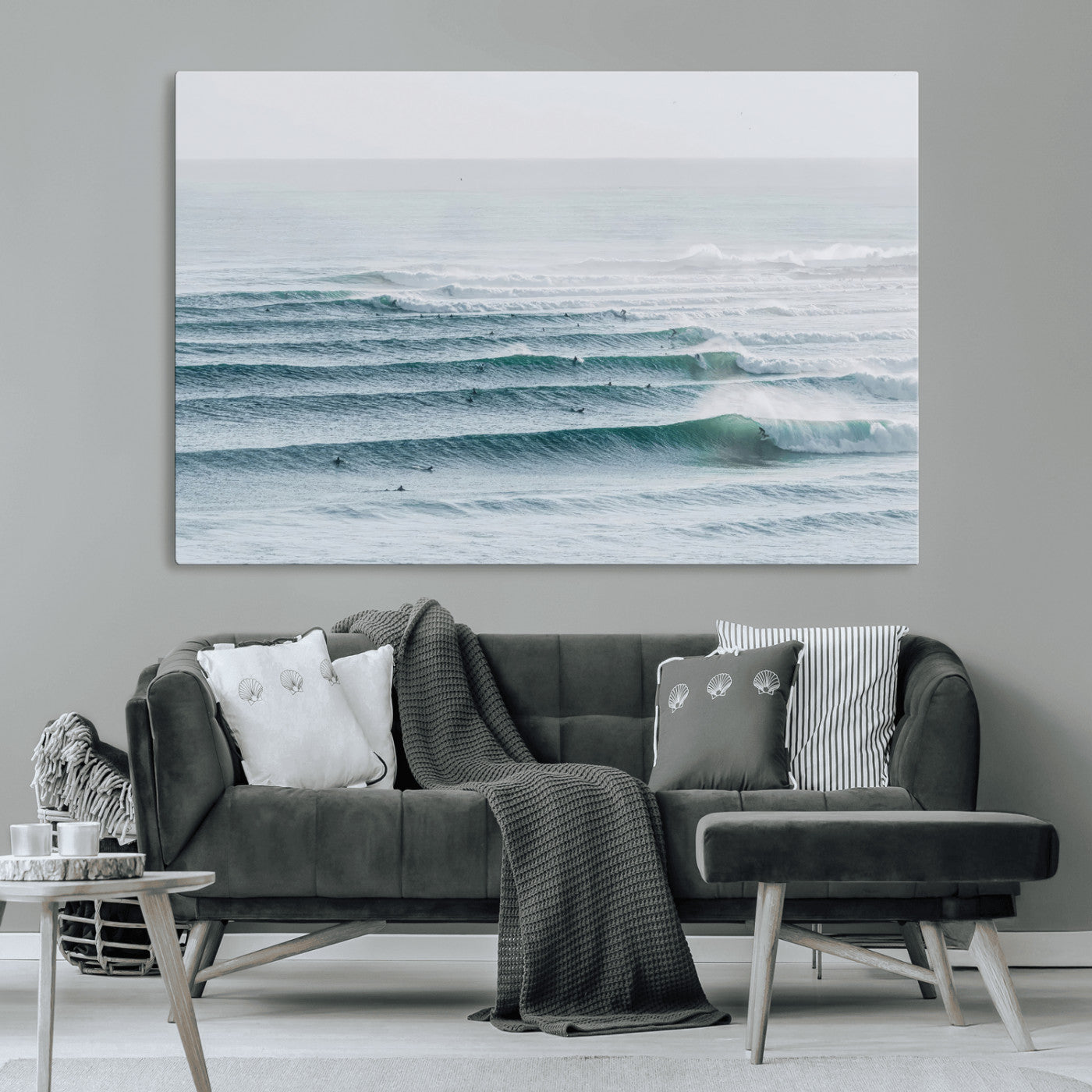 High-angle view of surfers lining up across layered ocean waves, ideal for minimal coastal or surf-inspired room decor.