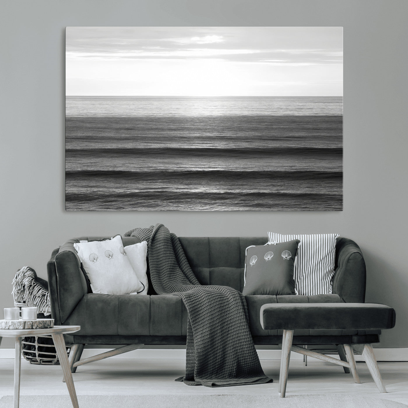 Minimalist black and white ocean view with layered waves reflecting sunlight, evoking a sense of calm and coastal serenity.