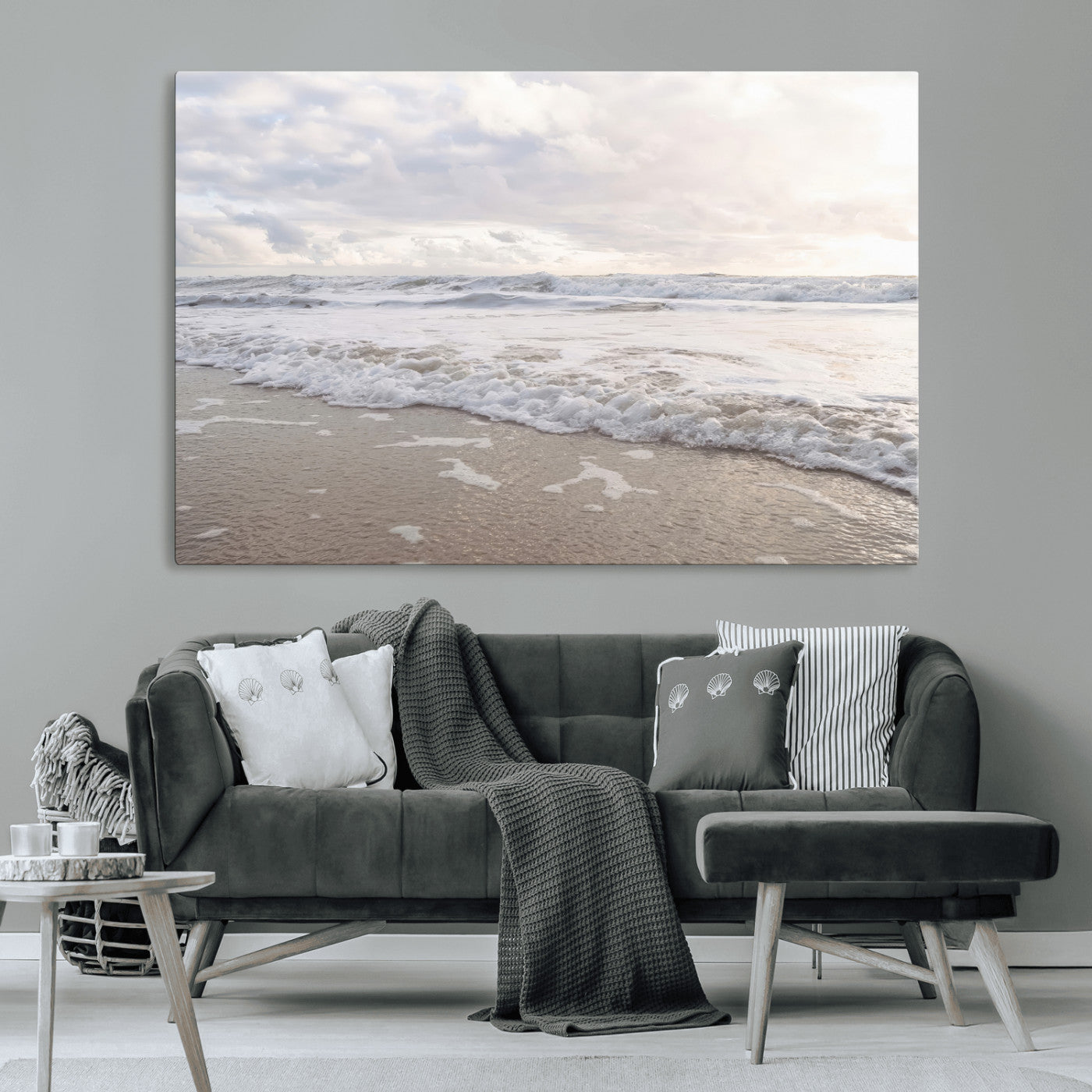 Peaceful ocean waves rolling onto the sandy shore under soft light, perfect for neutral or coastal minimalist decor themes.