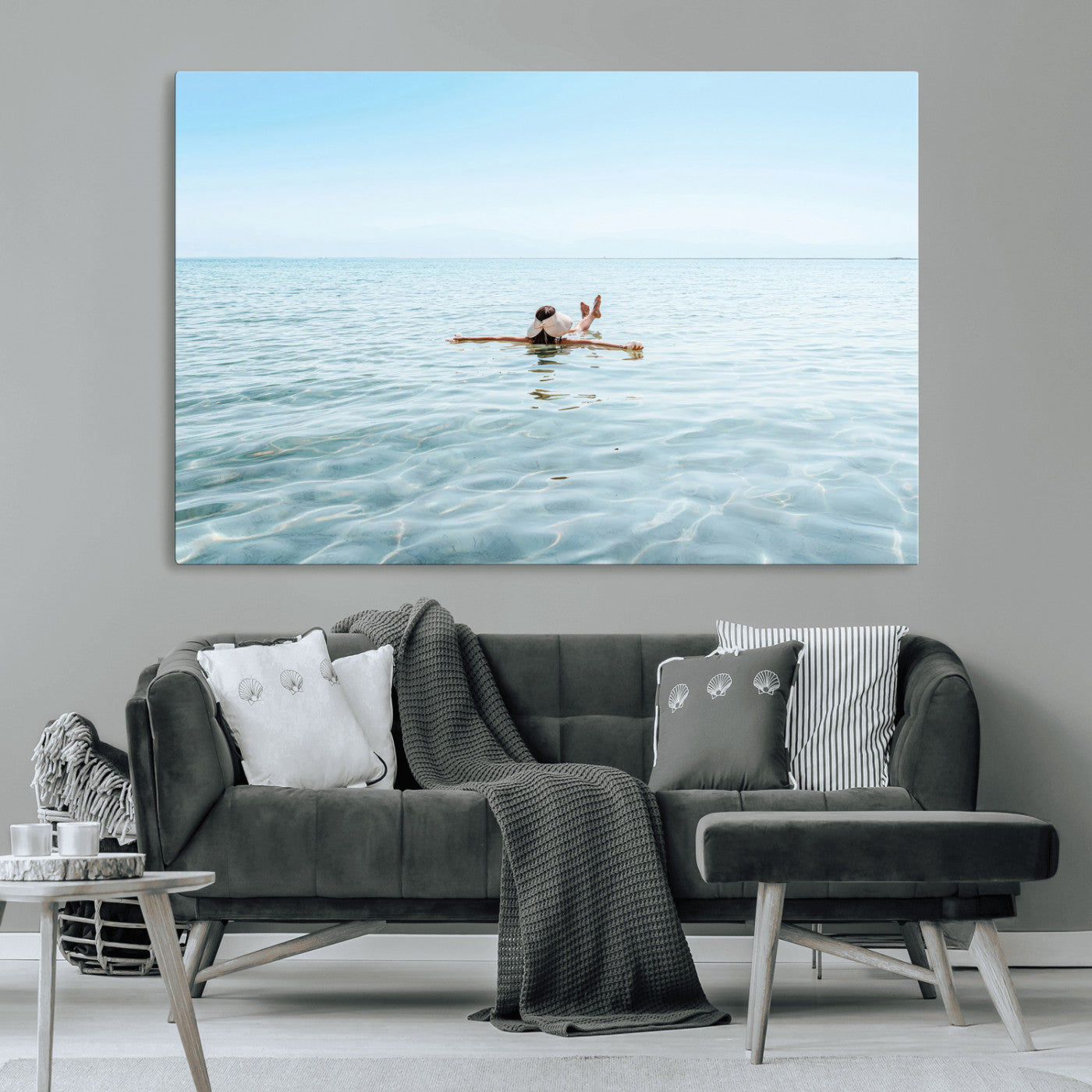 A peaceful minimalist scene of a person floating on crystal-clear water, surrounded by a vast open horizon, capturing relaxation and serenity in a tranquil aquatic setting.