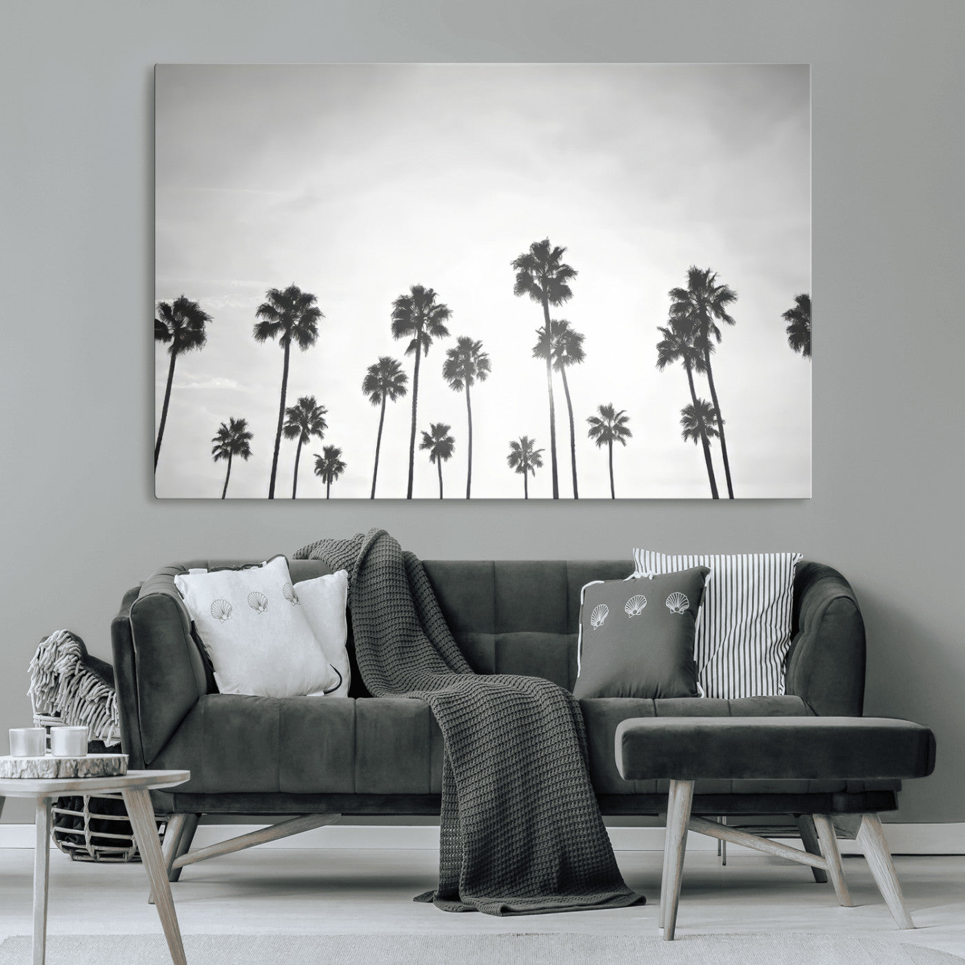 A black and white minimalist scene featuring tall palm trees silhouetted against a bright sky, creating a dreamy and timeless tropical aesthetic.