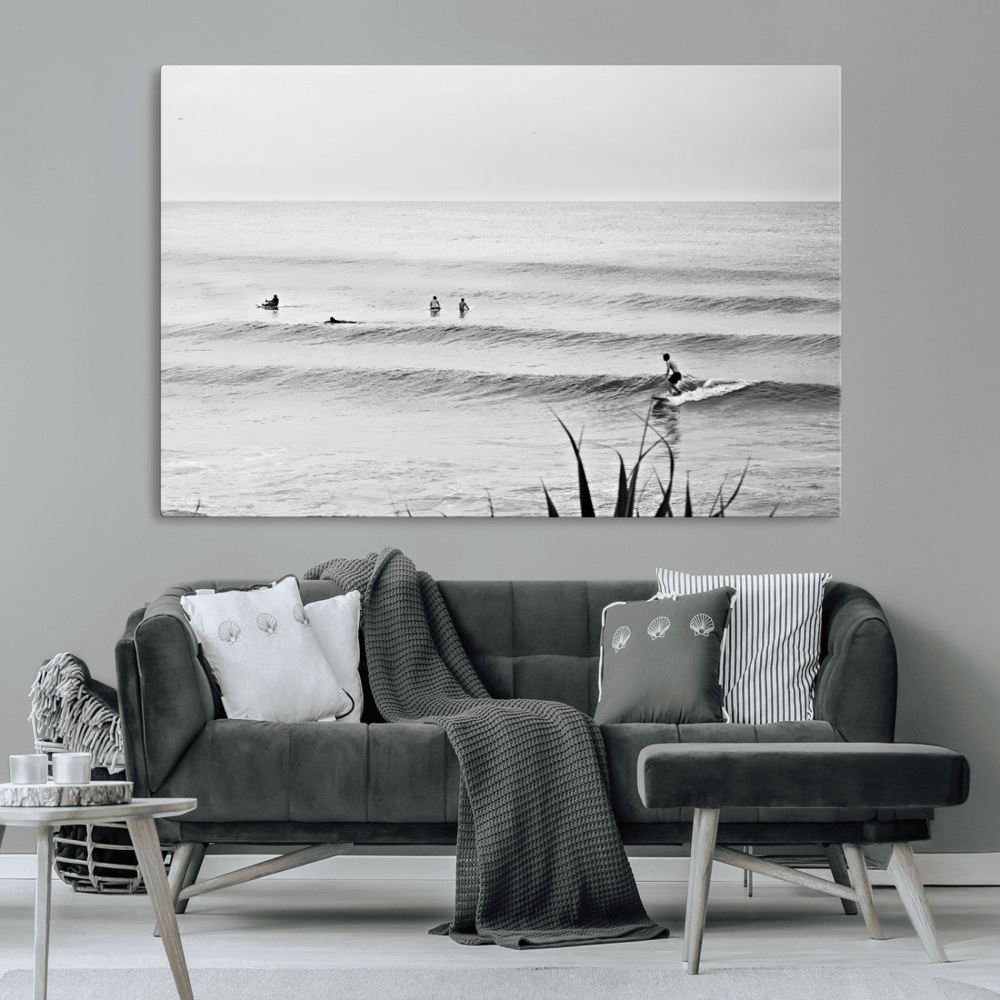 Monochrome canvas of surfers on calm ocean waves, ideal for minimalist coastal or beach-inspired interior decor.