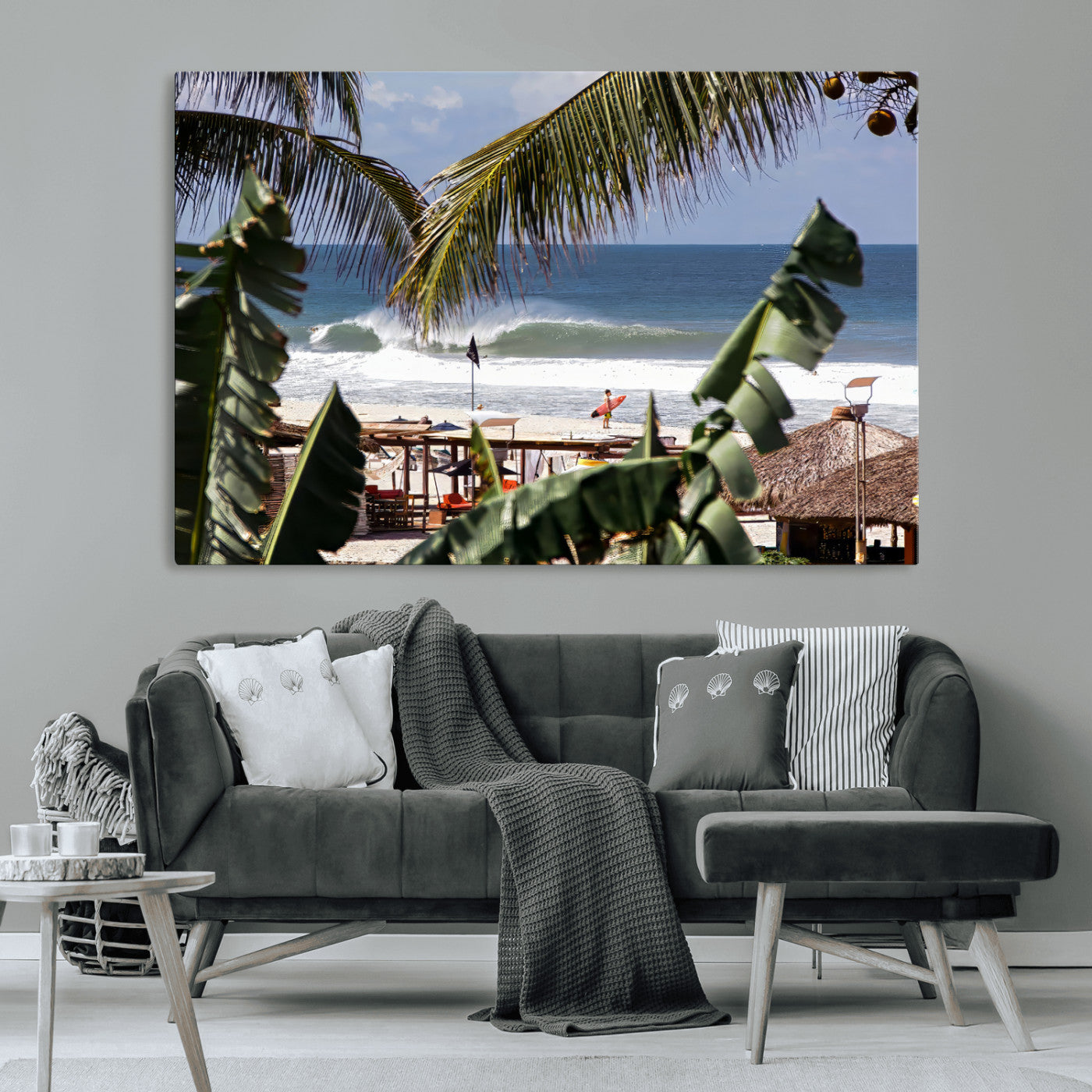 Canvas wall art of a tropical surf scene framed by palm trees, with a surfer on the shore and waves rolling in, ideal for beach-themed decor.