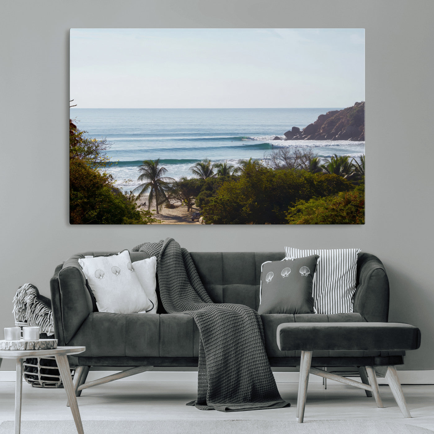 View of calm ocean waves with palm trees and a tropical coastline, ideal for coastal boho or beach-themed wall decor.