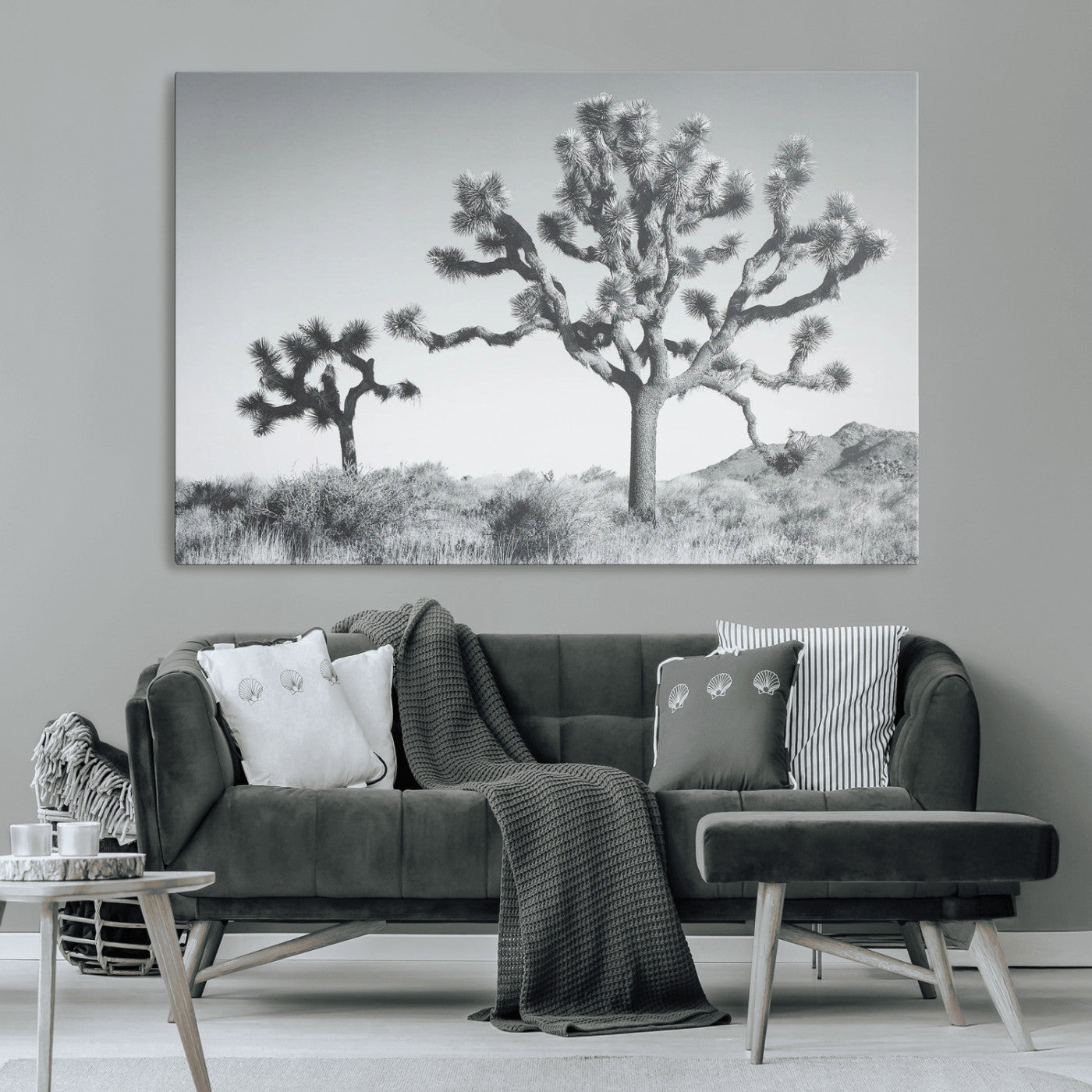 Two Joshua trees in a black and white desert landscape with distant hills, ideal for boho or rustic interior wall styling.