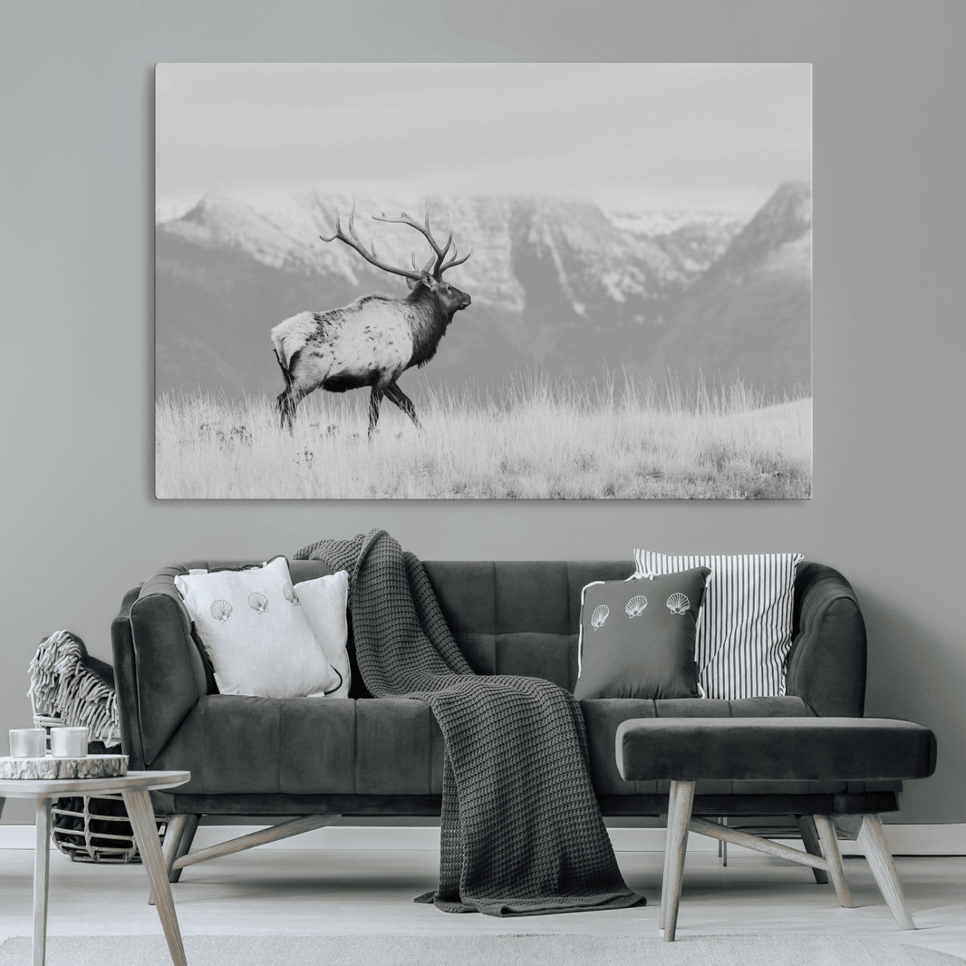 Black and white elk standing in front of snowy mountain range, perfect for rustic lodge or nature-inspired wall decor.