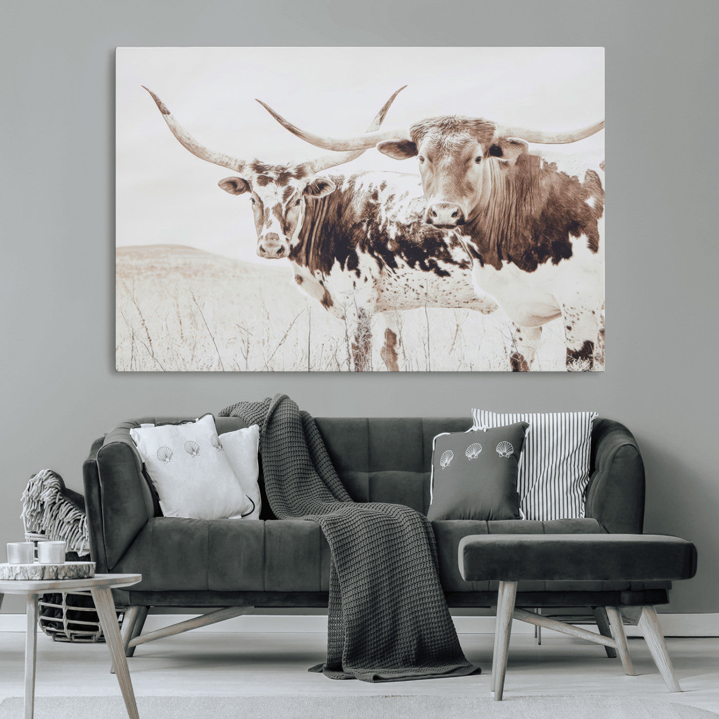 Two longhorn cows standing in a sepia-toned pasture with soft light, ideal for rustic or farmhouse-themed neutral wall decor.