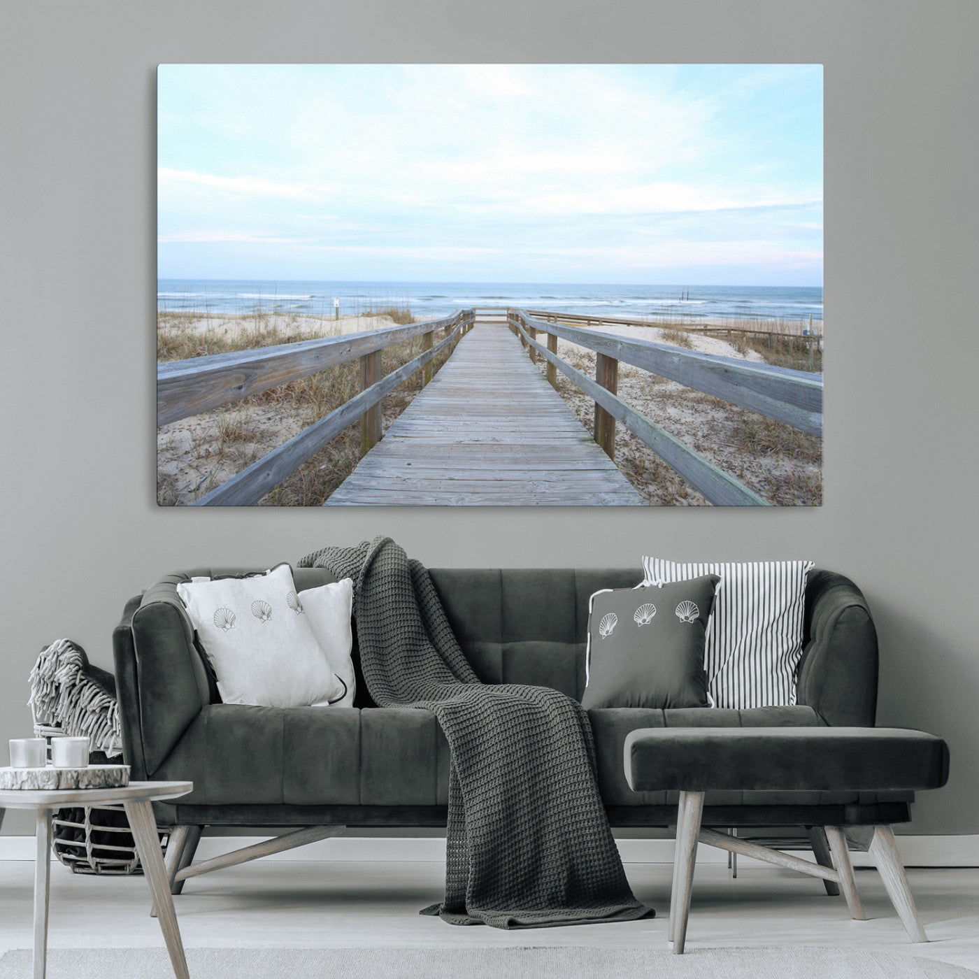 Wooden boardwalk leading to a peaceful beach with gentle ocean waves under a soft pastel sky, perfect for coastal and nautical home decor.