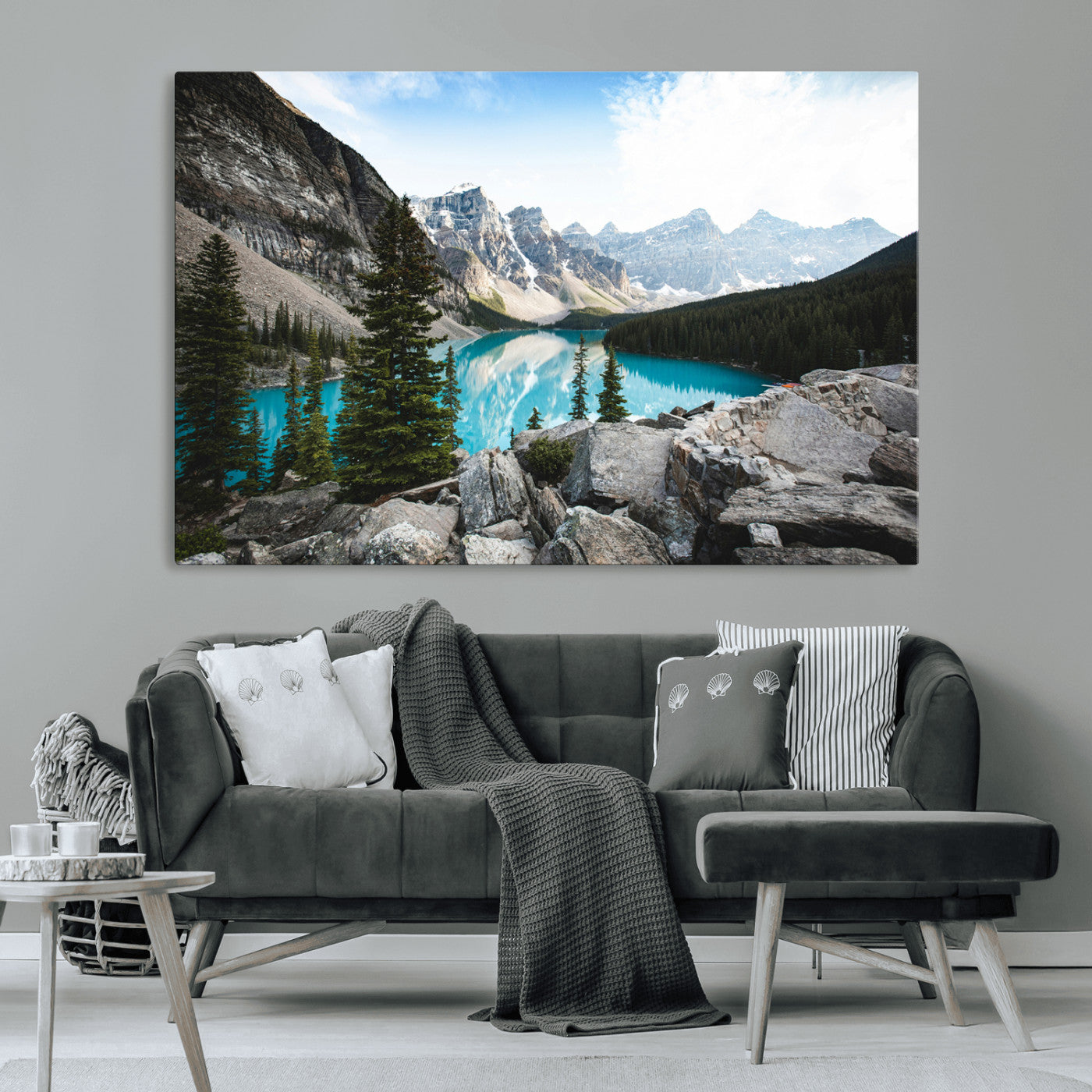 Stunning view of Moraine Lake with turquoise waters reflecting snow-capped mountains and evergreen trees, creating a peaceful alpine decor.