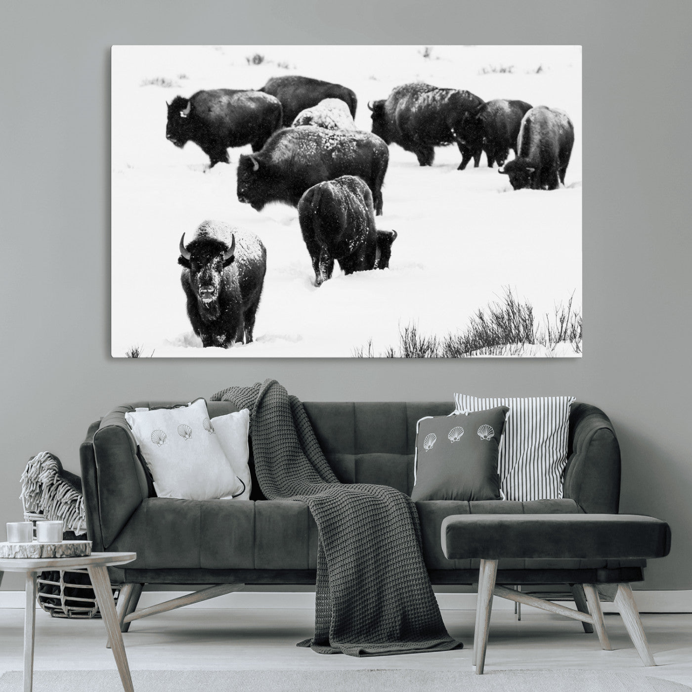 Black and white photograph of a bison herd in a snowy landscape, with snow-covered fur and a rugged wilderness setting, perfect for rustic lodge decor.