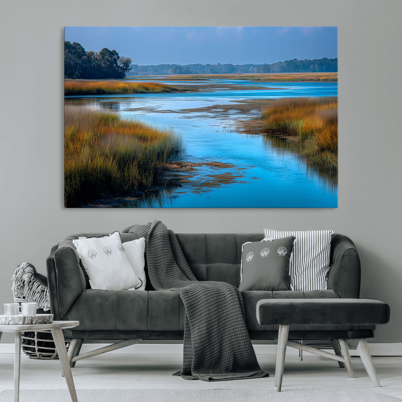 A peaceful marshland scene with calm blue water reflecting the surrounding grasses and trees, capturing the beauty of nature in a serene landscape.