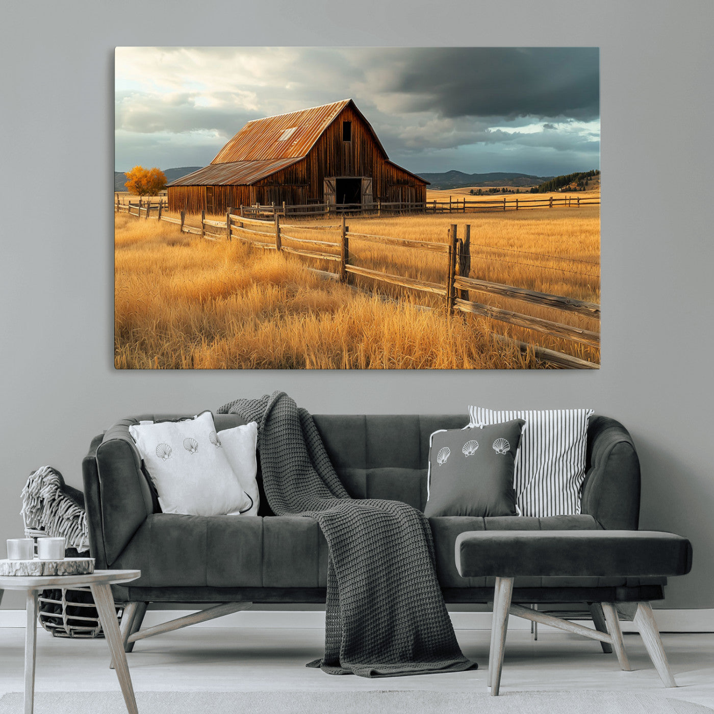 "Golden fields surrounding a rustic barn with a weathered roof, a wooden fence, and dramatic skies with sunlight breaking through the clouds."