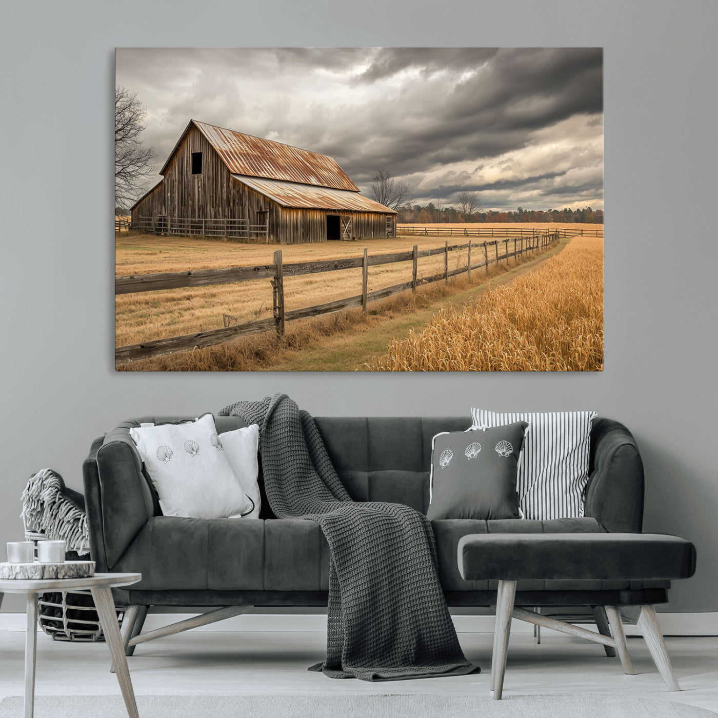 "Rustic barn with a weathered metal roof, surrounded by a wooden fence and golden fields under an overcast sky with dramatic clouds."