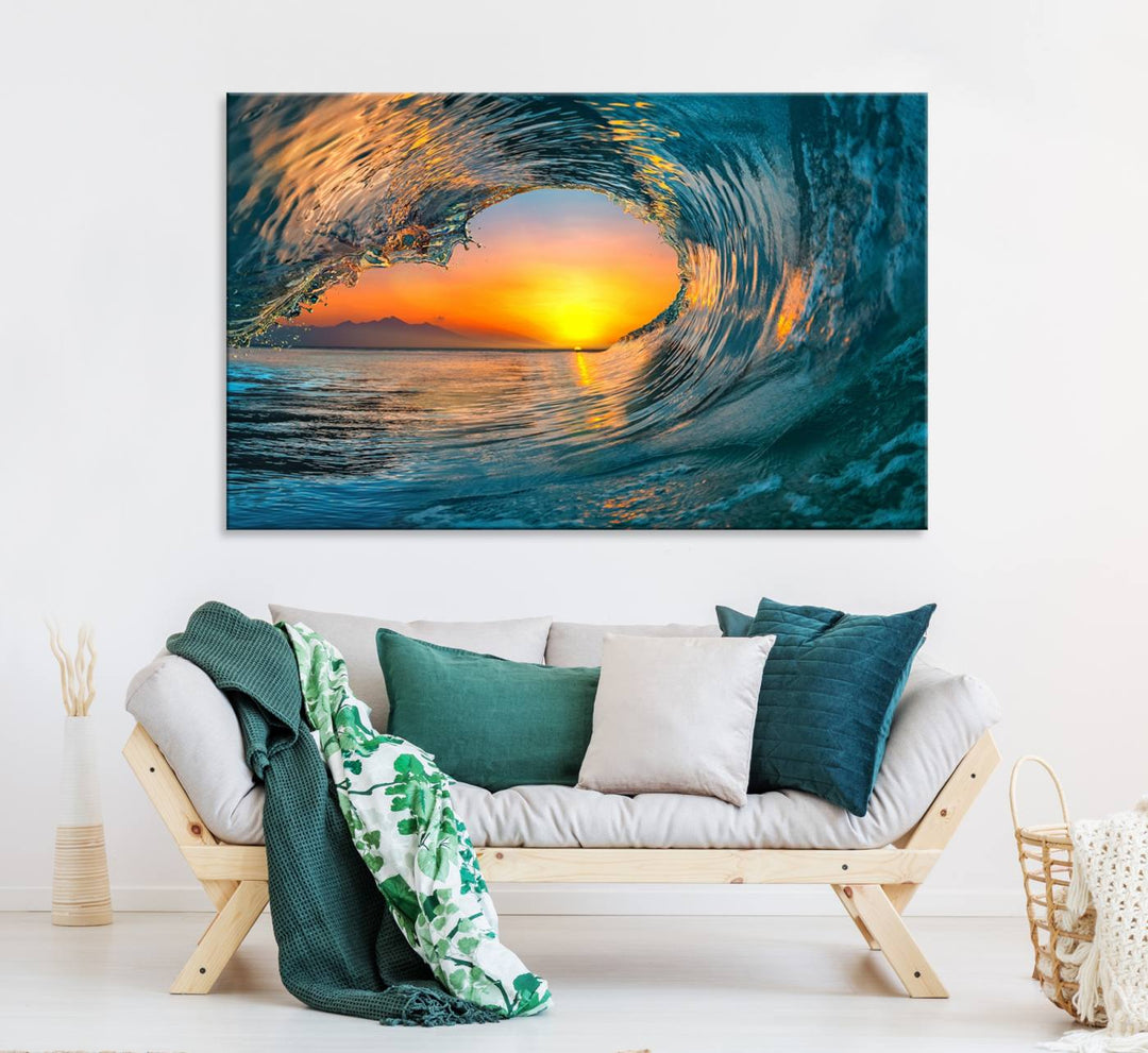 The Ocean Wave Sunset Wall Art canvas print features a vibrant ocean wave at sunset, forming a tunnel with silhouetted mountains.