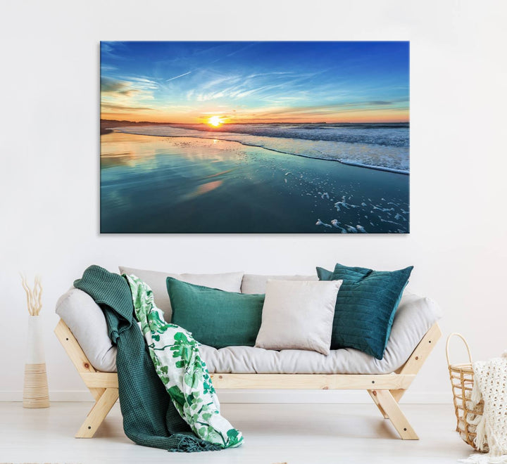 The Blue Sky and Beach Wall Art Canvas Print features a vibrant orange sky reflecting on wet sand.