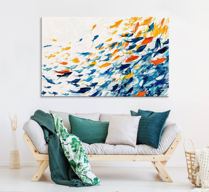 A colorful Abstract Fish Shoal Canvas Print hangs on the wall.