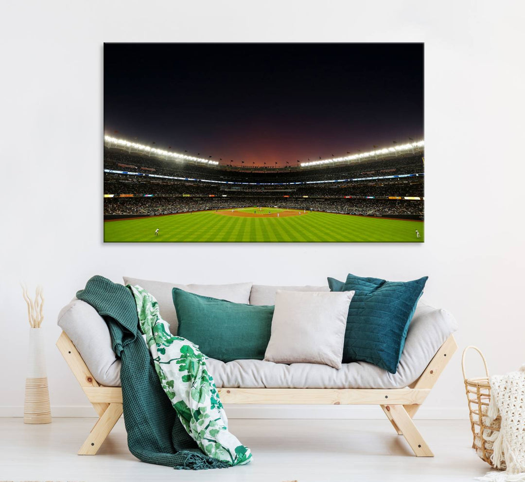 A night game at Yankee Stadium depicted on canvas beneath a sunset sky.