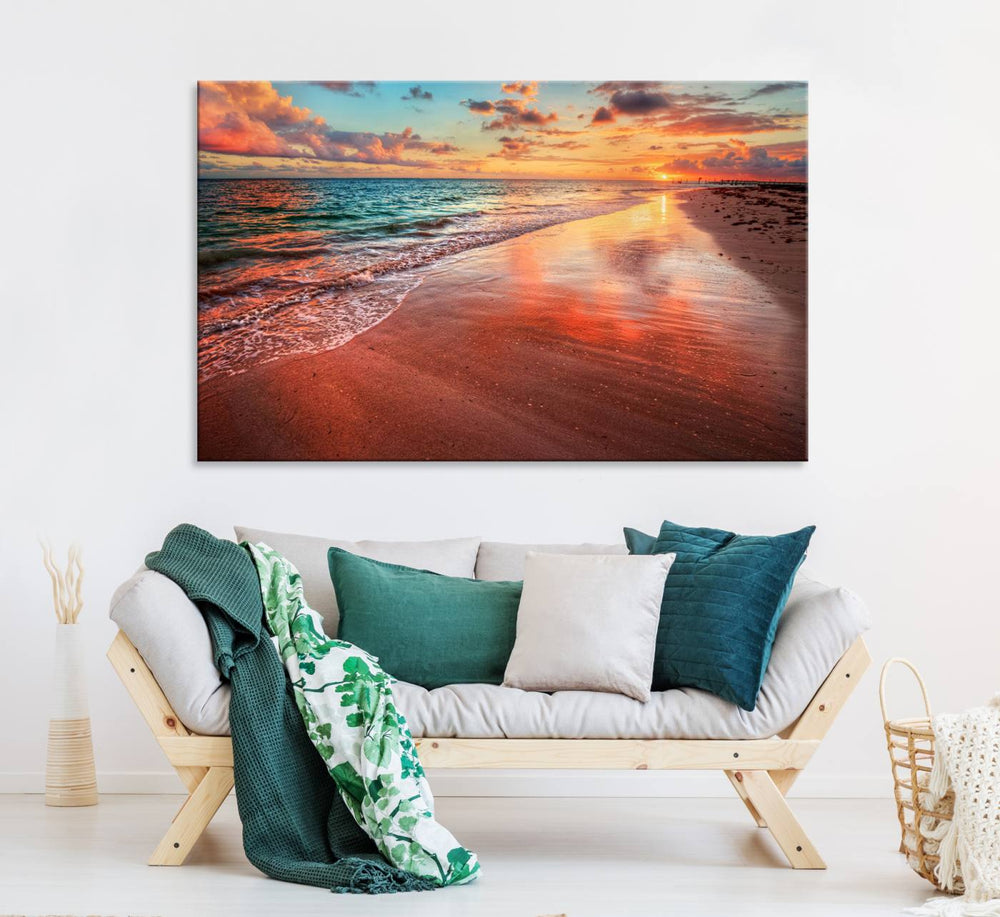 An Ocean Canvas Print depicts a sunset over a beach with reflections.