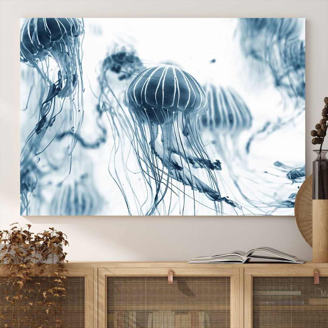 The "Abstract Jellyfish Wall Art Canvas Print" in high resolution is beautifully displayed as a triptych on a dark wall. Experience museum-quality canvas and enjoy free shipping with this stunning piece.