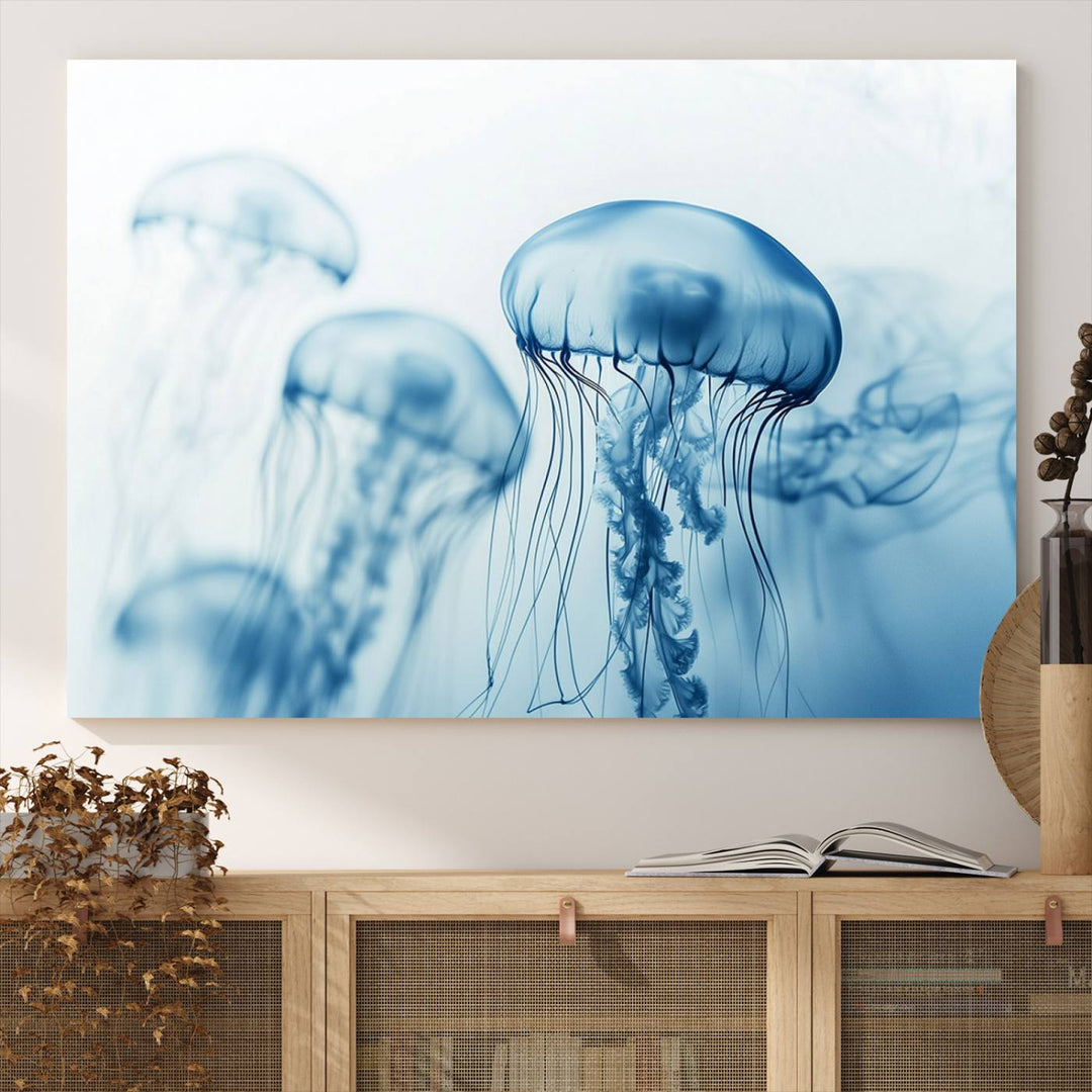 A breathtaking triptych of the Blue Jellyfish Wall Art Canvas Print decorates the space, beautifully highlighted by an overhead lamp. Each canvas is created on museum-quality material using high-resolution printing and includes a UV-protective coating to ensure long-lasting vibrancy.