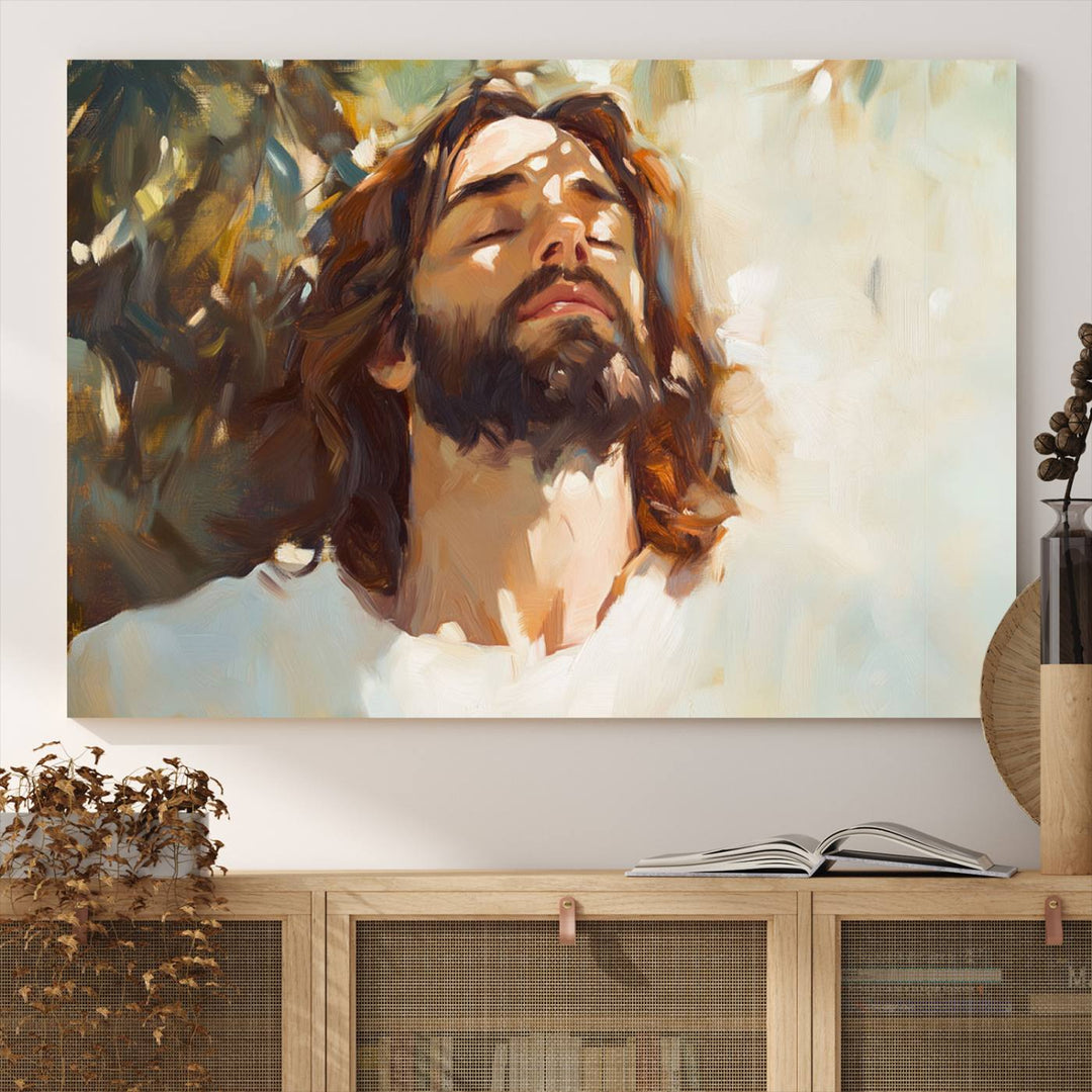 The Jesus Portrait Wall Art Canvas Print features a depiction of Jesus Christ with closed eyes, basking in sunlight. His expression exudes a peaceful, spiritual atmosphere against a blurred background.