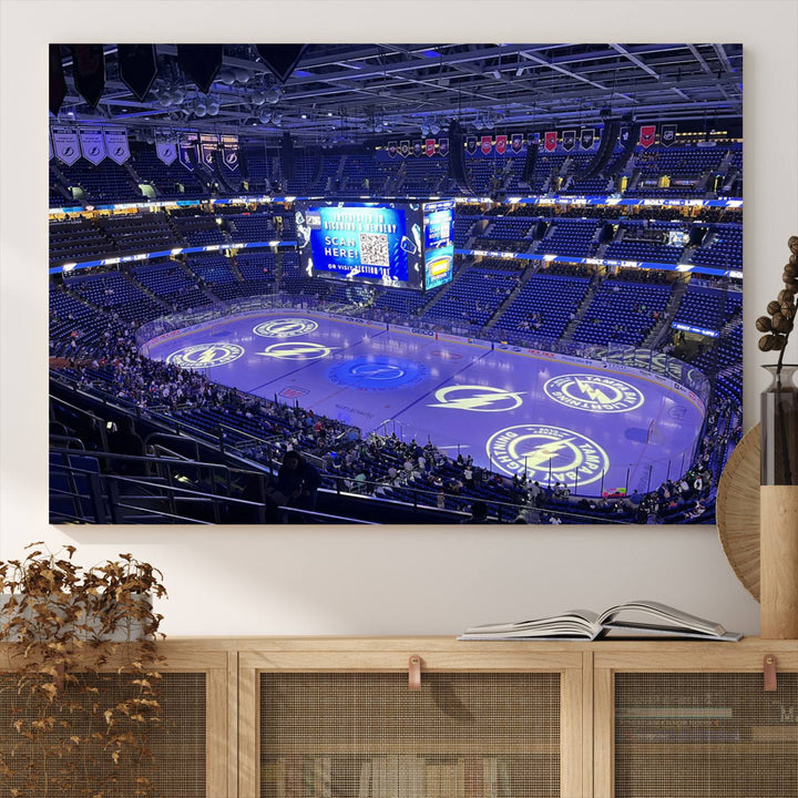 The wall art canvas print at Amalie Arena features team logos on ice, encapsulating the vibrant atmosphere of an NHL hockey stadium.