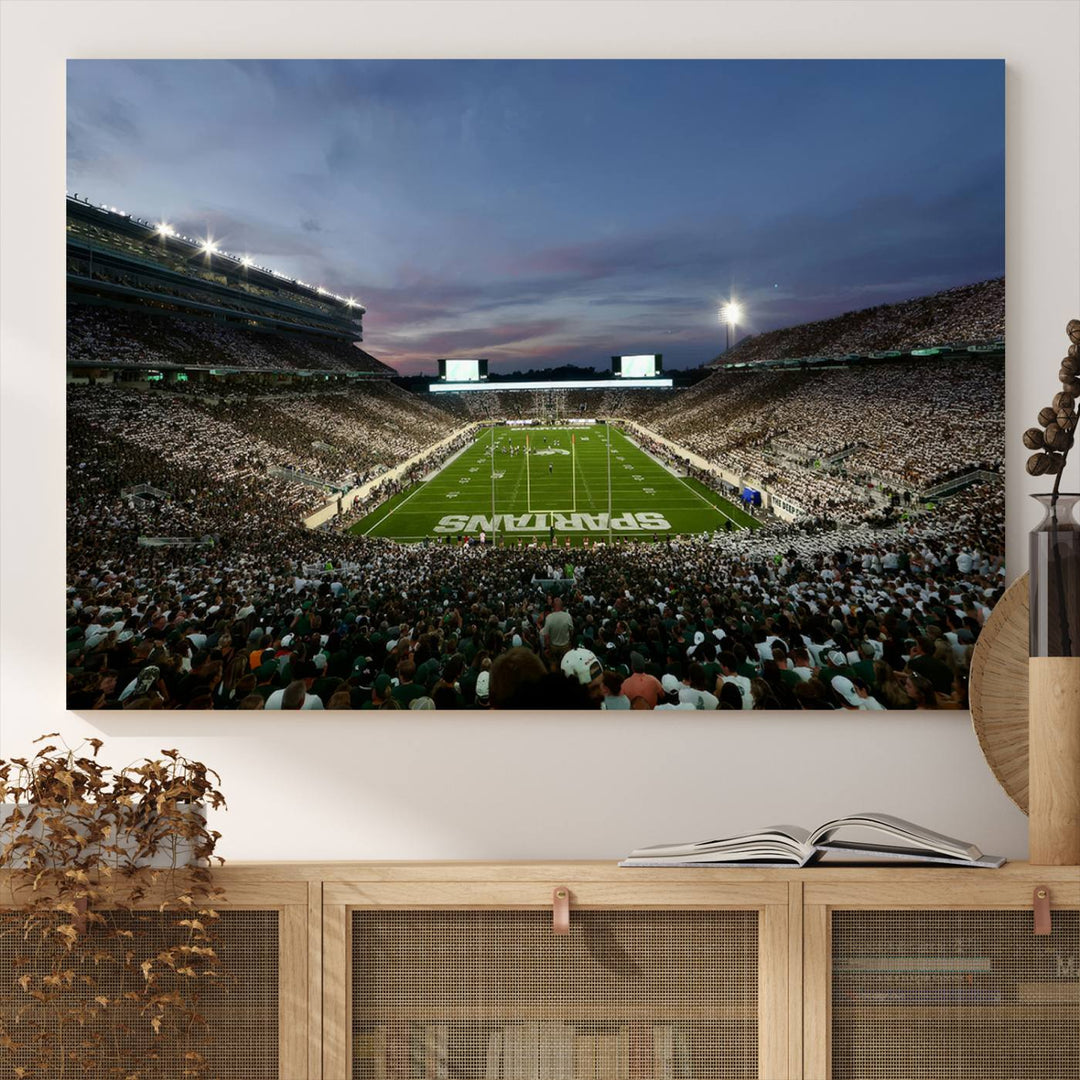 Wall art featuring a stadium at dusk with full stands—ideal for the Michigan State Spartans Football Team Canvas Print.