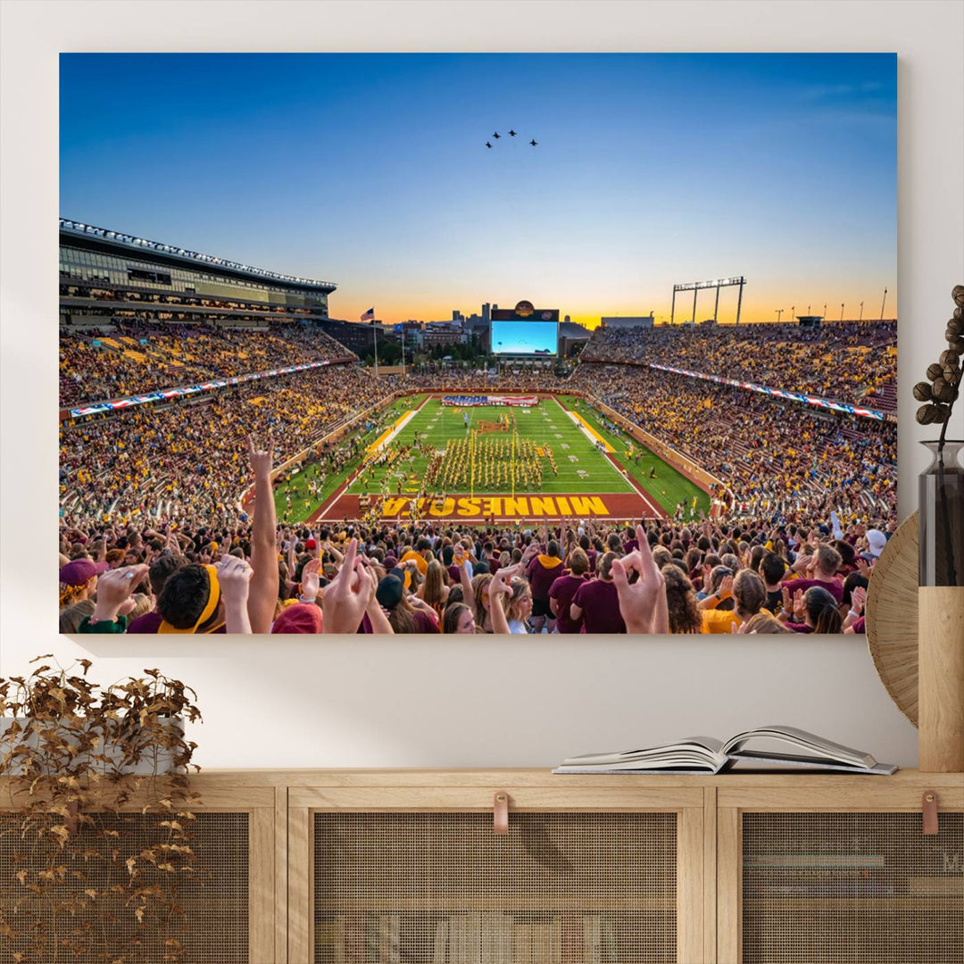 Canvas wall art featuring the University of Minnesota Football Team print, showcasing Huntington Bank Stadium at sunset with jets overhead.