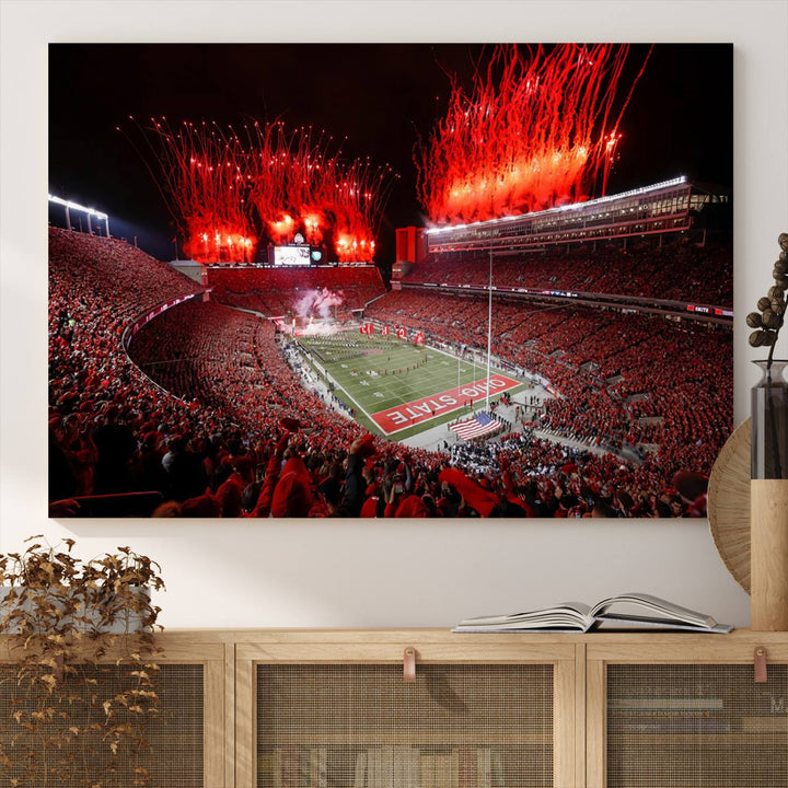 A vibrant red canvas art of a packed Ohio State Buckeyes stadium at night with fireworks.