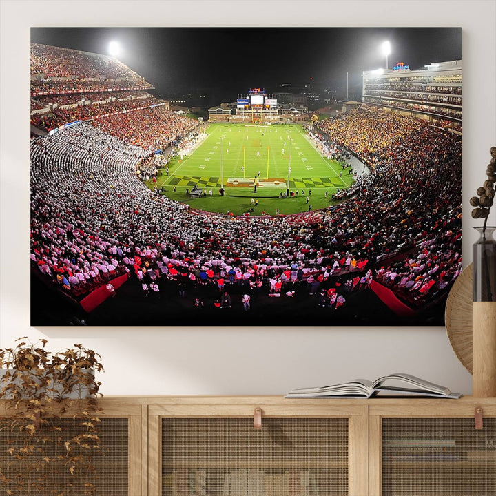 The Maryland Terrapins Football Wall Art Canvas showcases a packed SECU Stadium at night with a bright field and cheering fans.