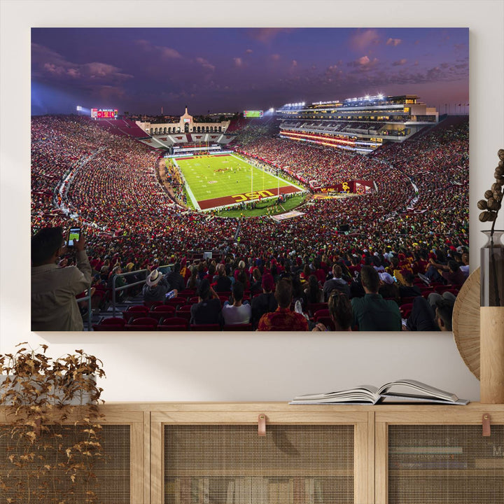 The vibrant wall art canvas print captures the USC Trojans playing under lights at dusk in LA Memorial Coliseum.