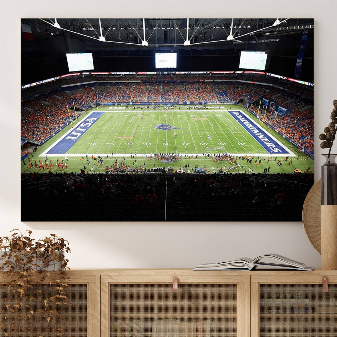 The UTSA Roadrunners game at Alamodome canvas print captures the scene from above, displaying fans and the UTSA lettering on the field.