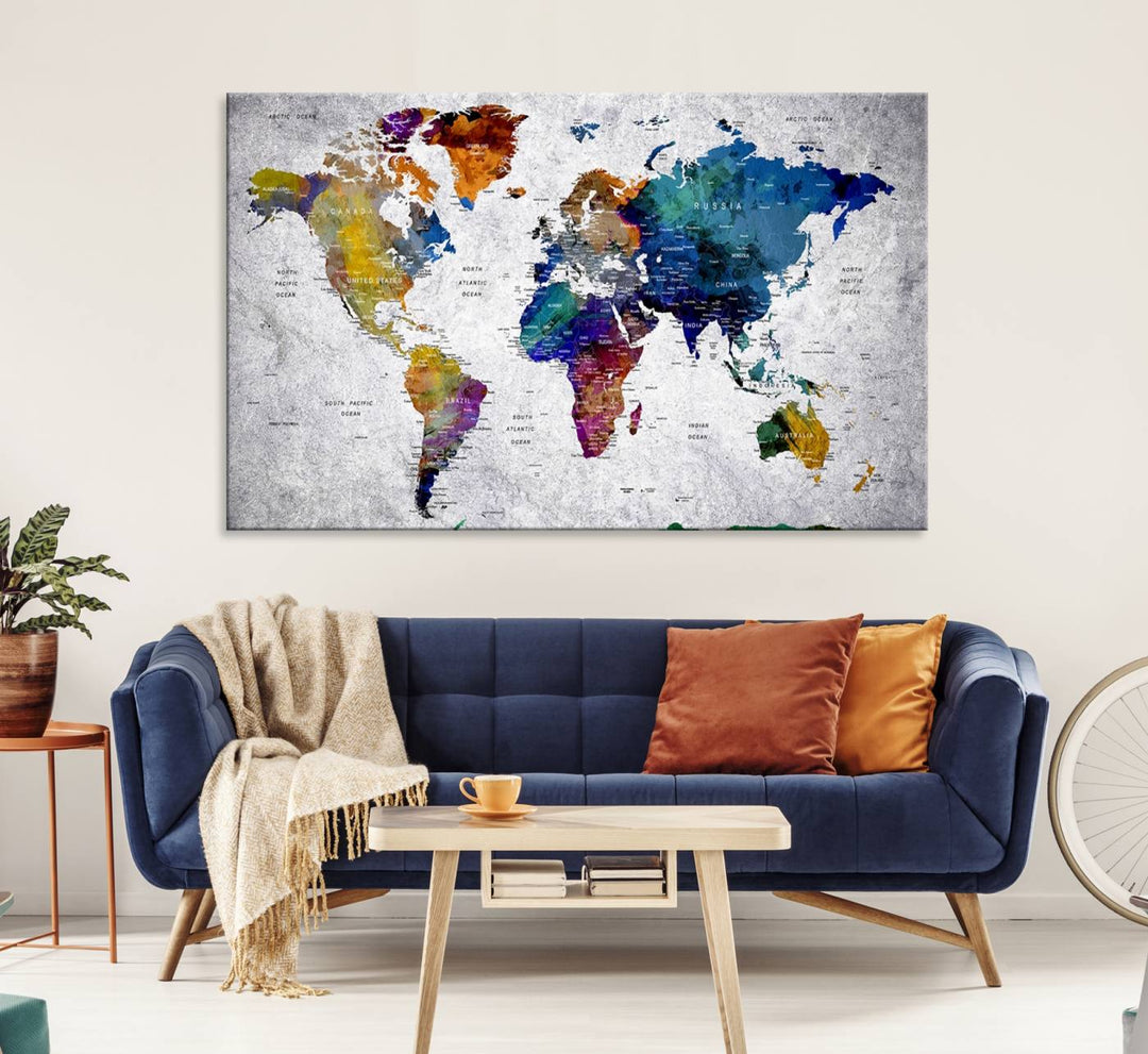 The World Map Art Canvas Print, featuring country names on a grunge-stained gray background, is perfect for stylish home decor.