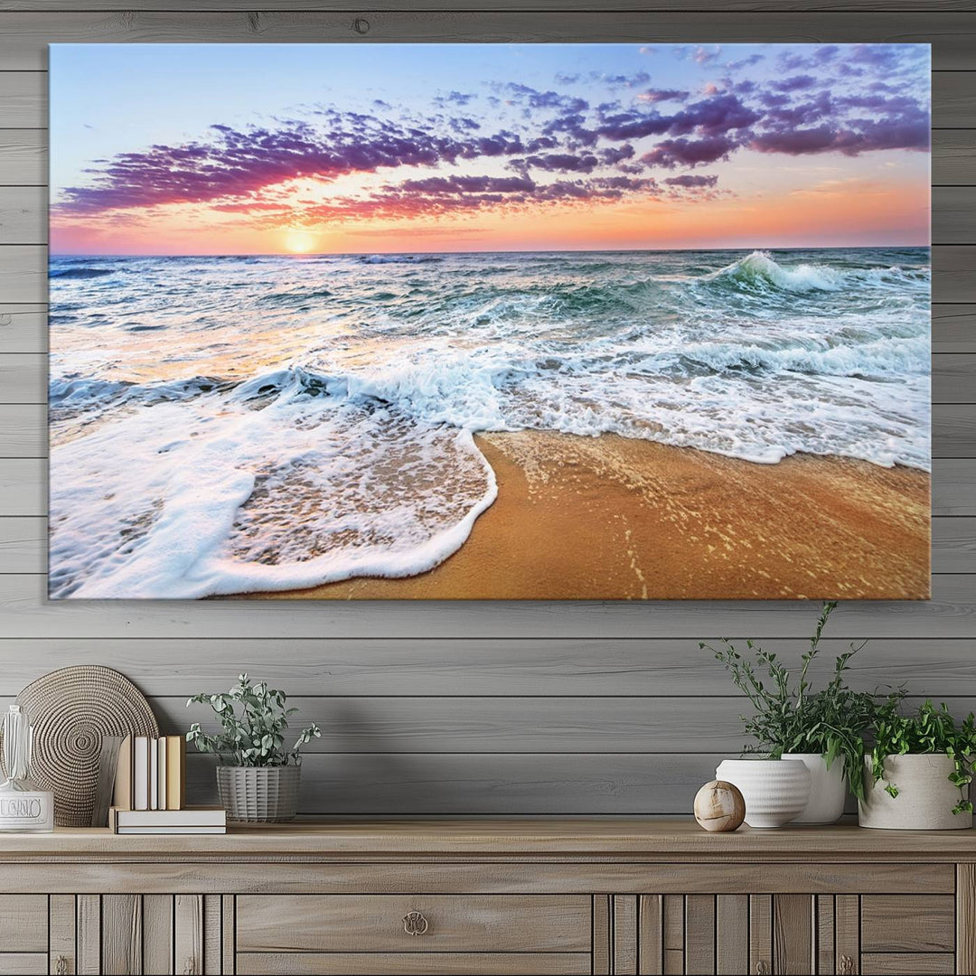 The Tropical Beach Waves Art Print, depicting an ocean sunset and sandy shore, enriches the coastal decor of the dining area.