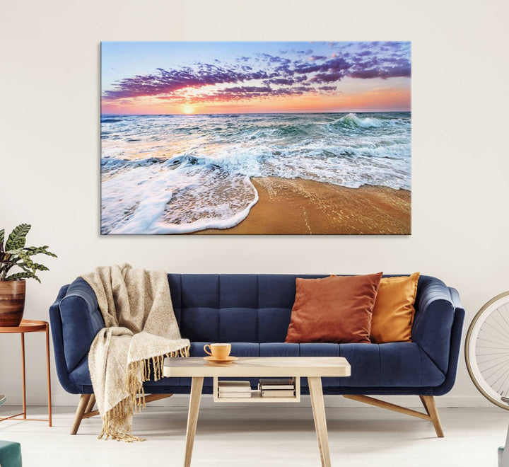 The Coastal Sunset Art Canvas Print features ocean waves beneath a vibrant sky in a stunning 3-panel seascape.