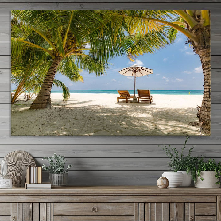 The canvas art print titled Lounge Chairs Palm Trees on Tropical Beach offers free shipping.