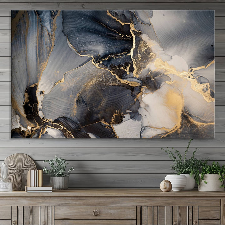 A Modern Marble Fluid Effect Abstract Wall Art with black, white, and gold swirls hangs in a modern kitchen.