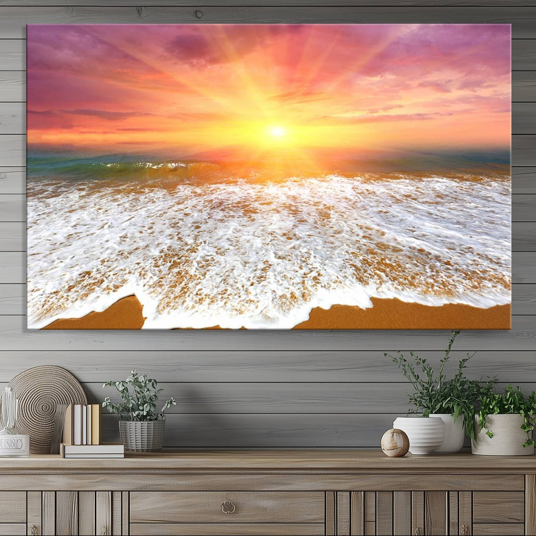 Golden Beach Sunrise 3-panel canvas art of ocean waves, hung on a wooden wall.