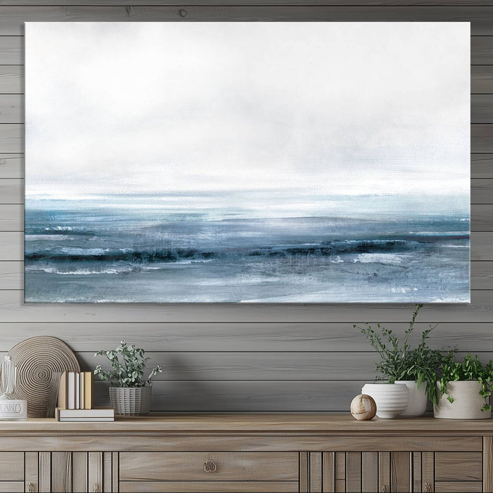 The dining area features Blue Ocean Abstract Artwork on canvas.