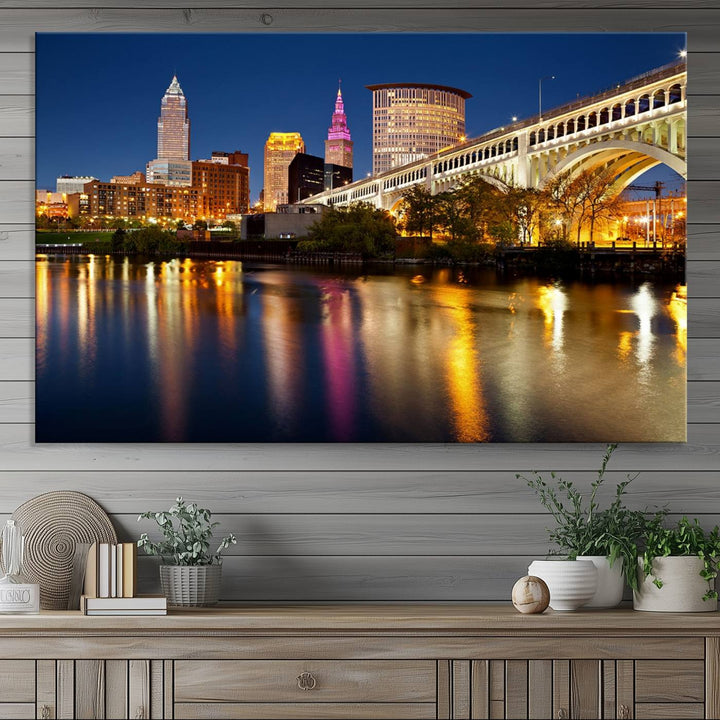 Cleveland Night Skyline Canvas: Cityscape with an illuminated bridge reflecting on calm water.