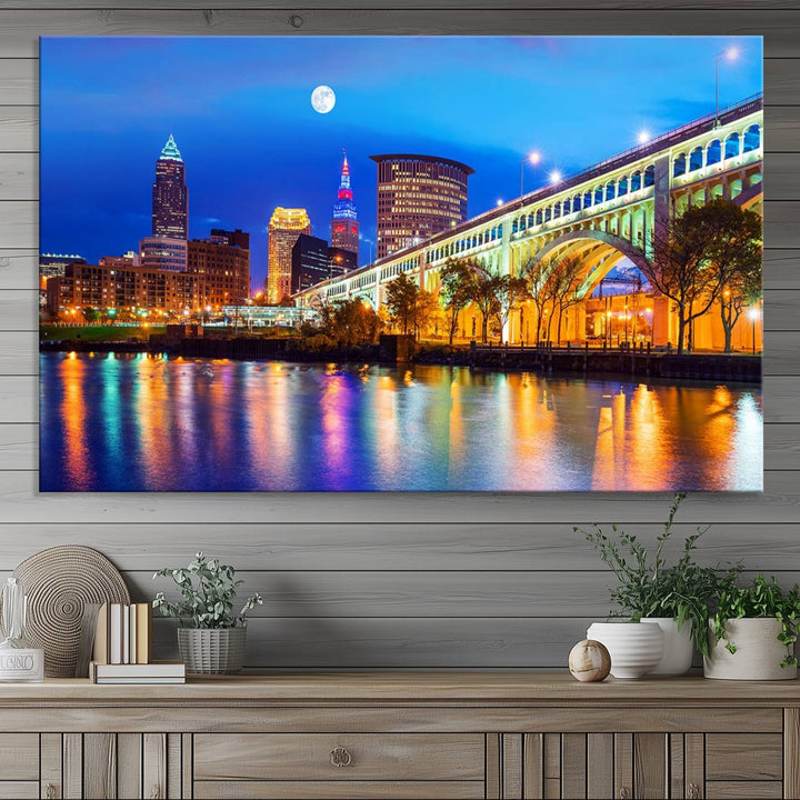 A Cleveland Night Skyline Wall Art on museum-quality canvas showcases a bridge and illuminated buildings.