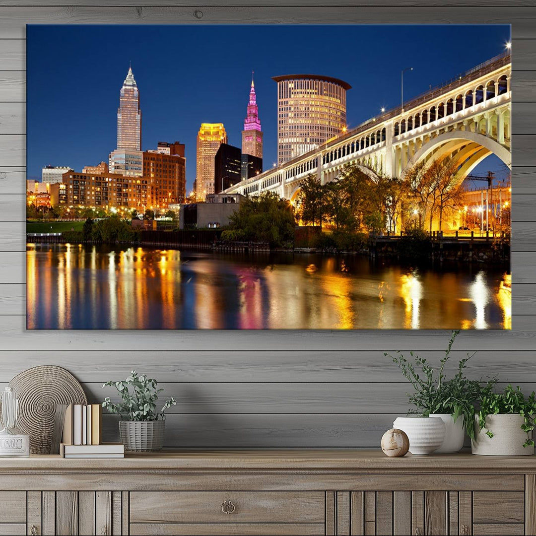 The Cleveland City Lights Canvas showcases a lit-up bridge and cityscape at night.