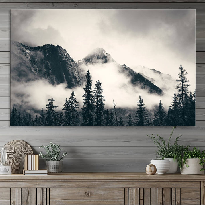 A large foggy mountain forest canvas print hangs prominently in the room.